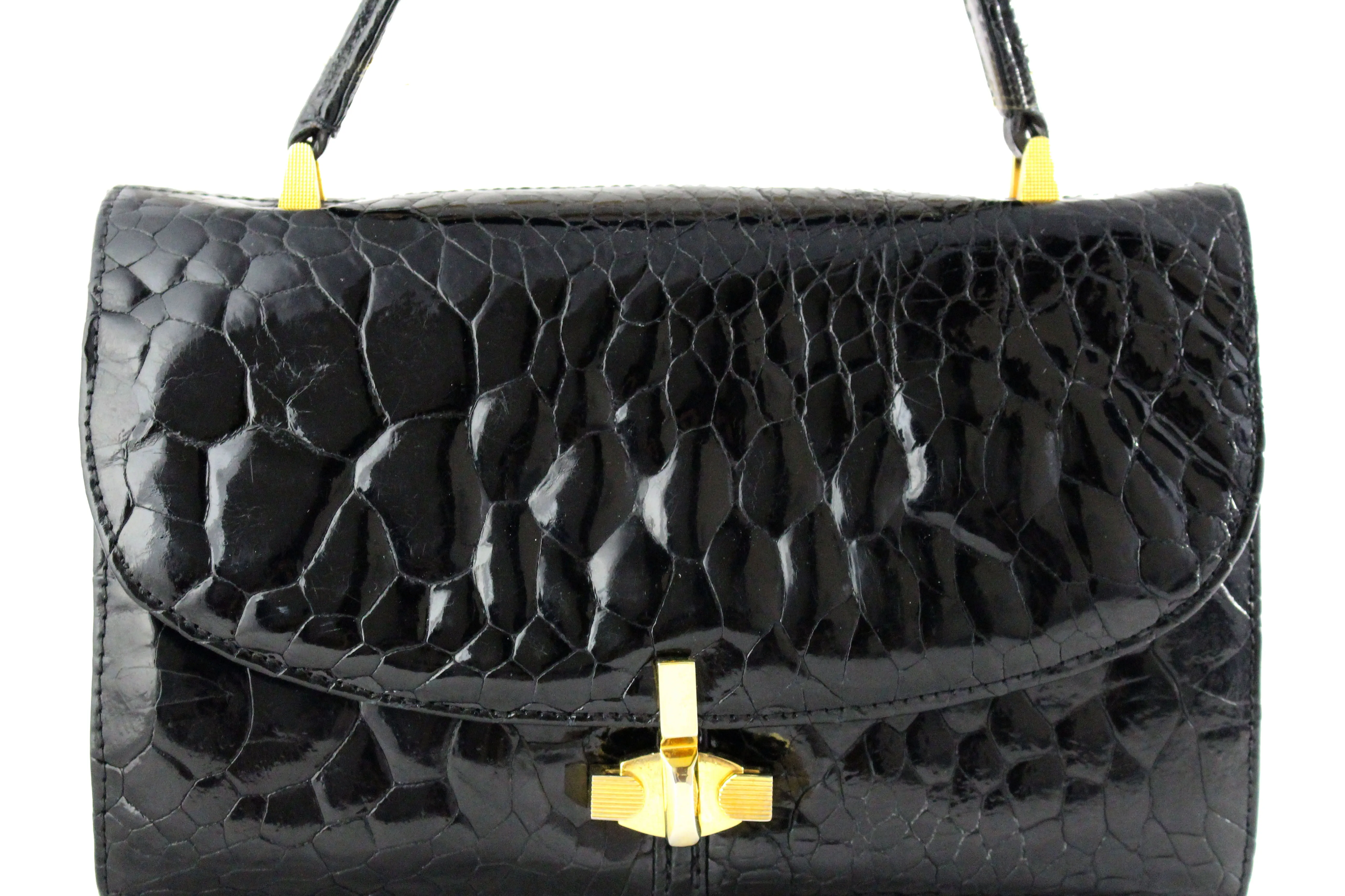 Black turtle skin flap bag with top handle