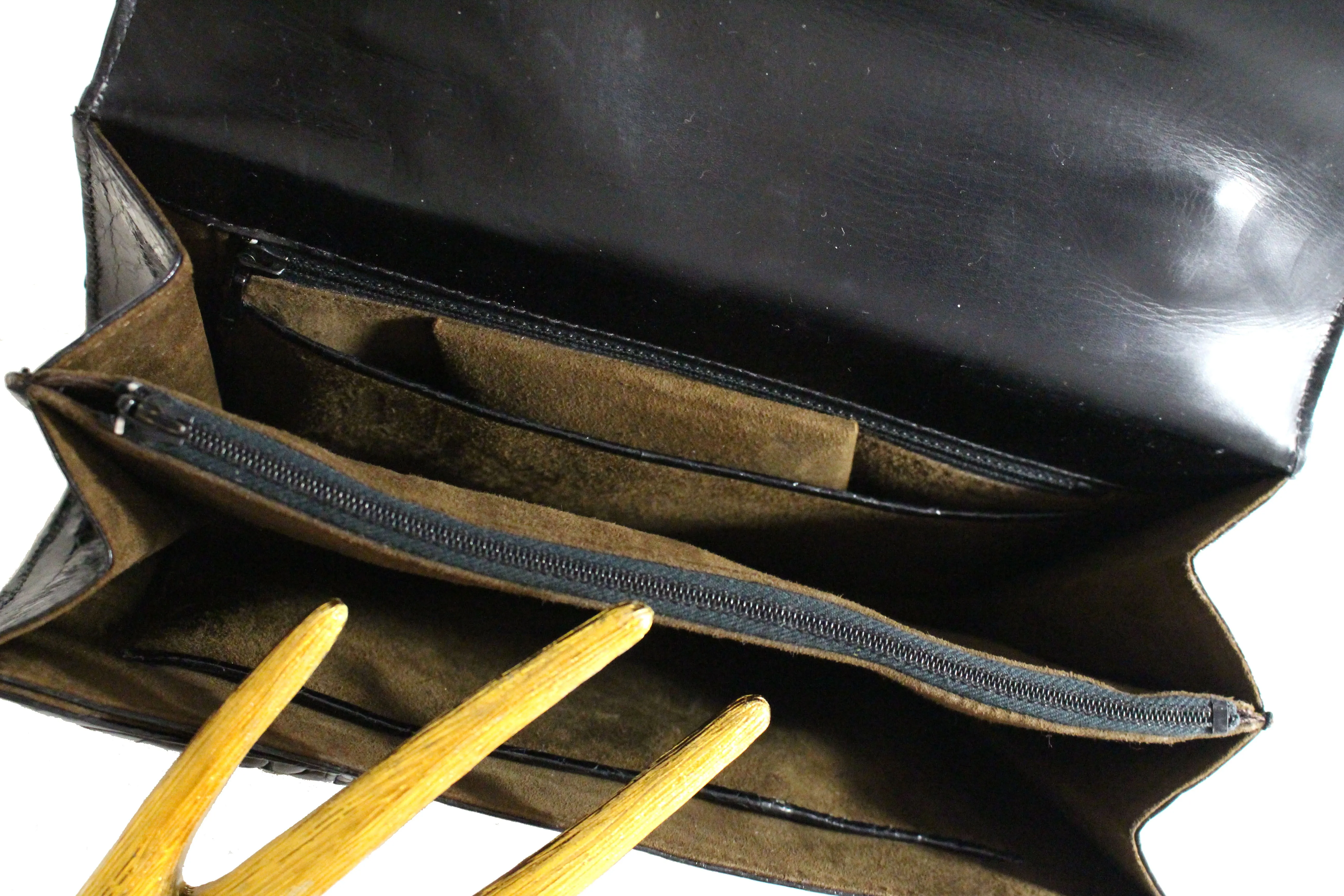 Black turtle skin flap bag with top handle